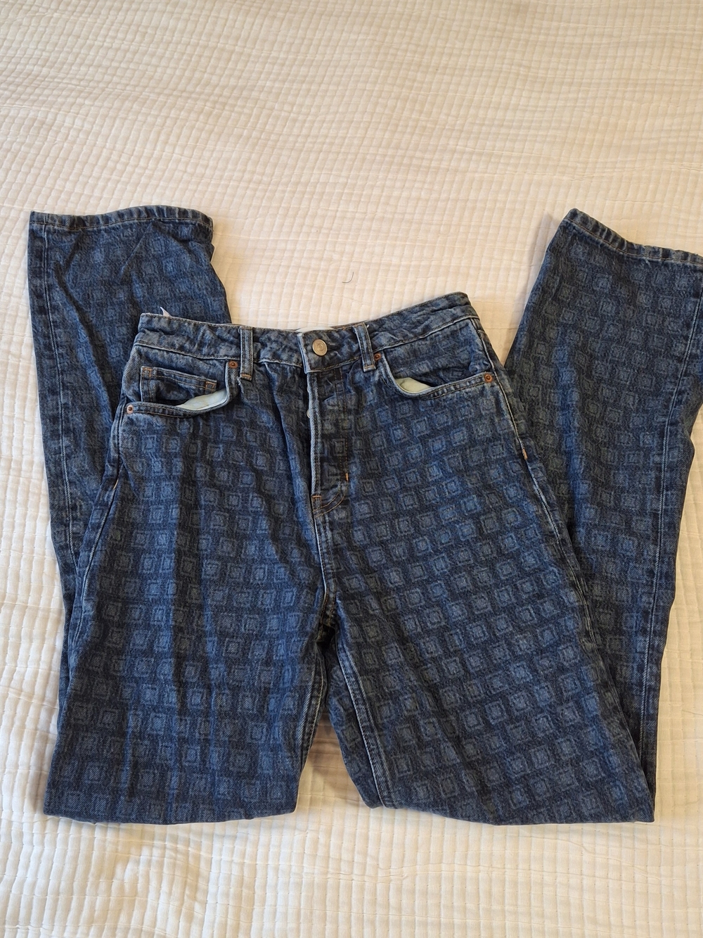 Reformation blue denim jeans with repeating geometric Disco pattern
